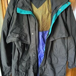 Eddie Bauer all weather jacket Black Jacket with blue green zip pockets On Sale